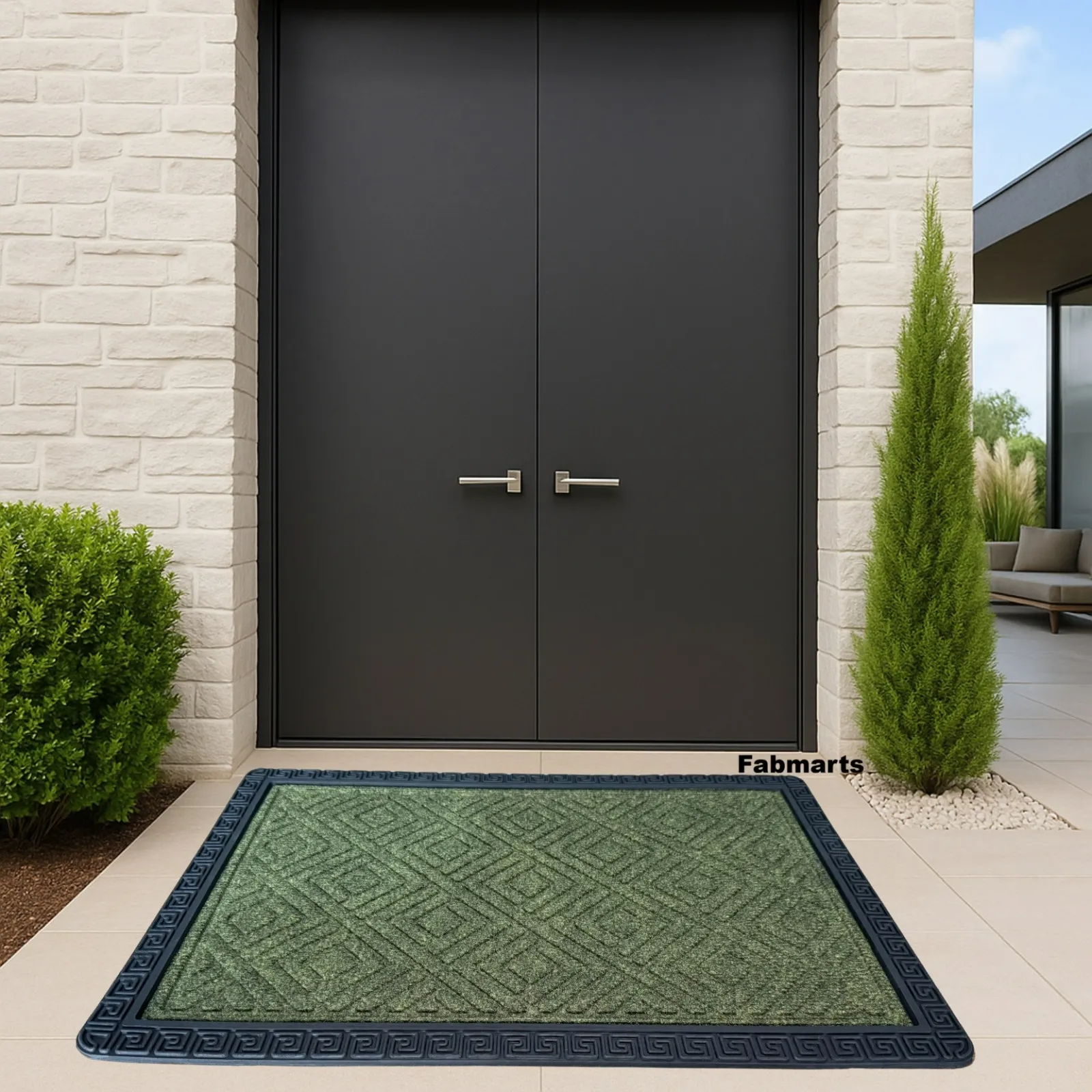 Green diamond-pattern entrance mat with a black rubber frame at a front door
