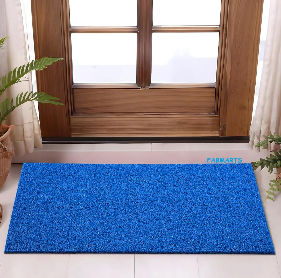 Blue PVC noodle coil door mat beside a window